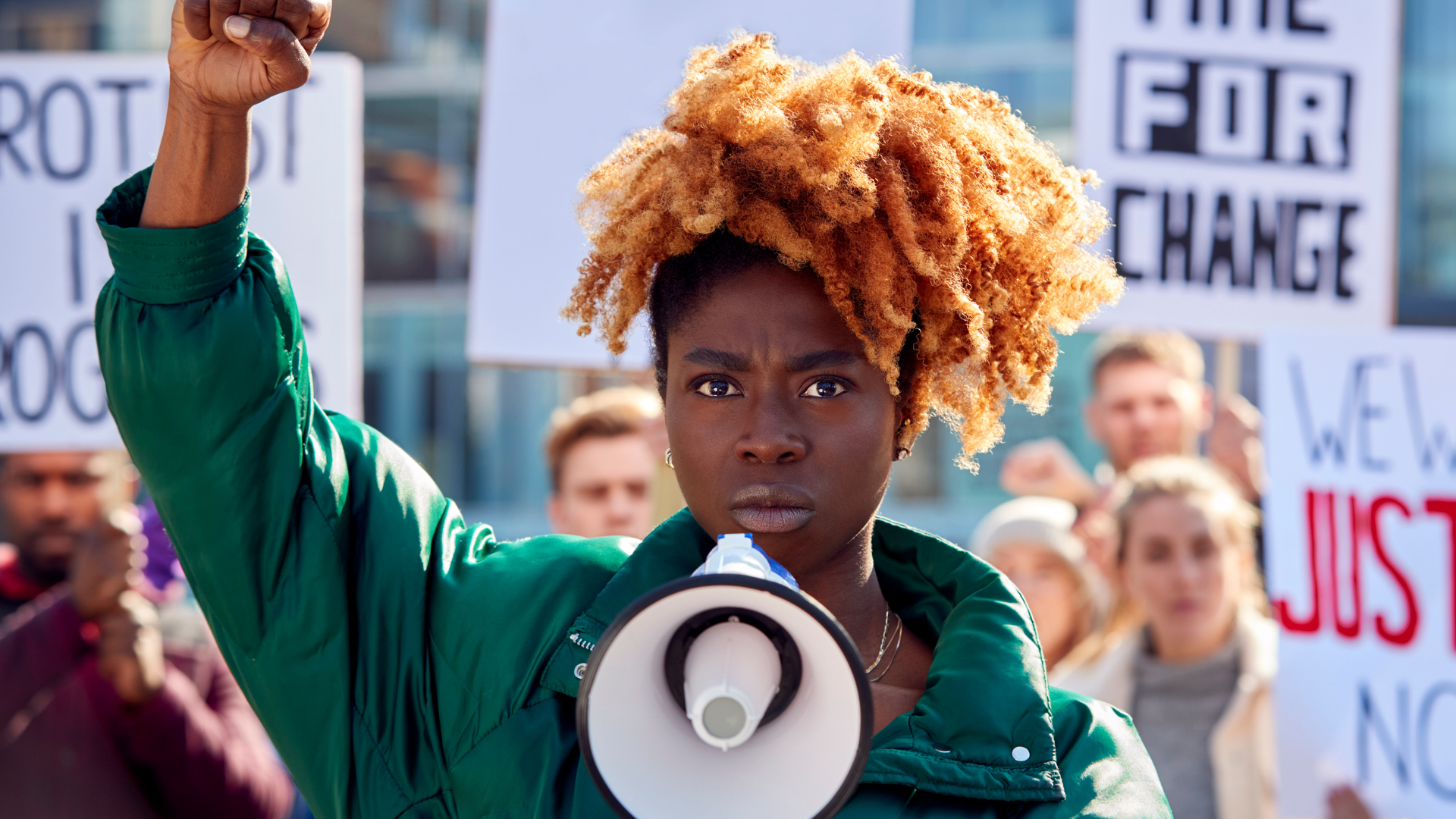 Community member speaking out at a rally
